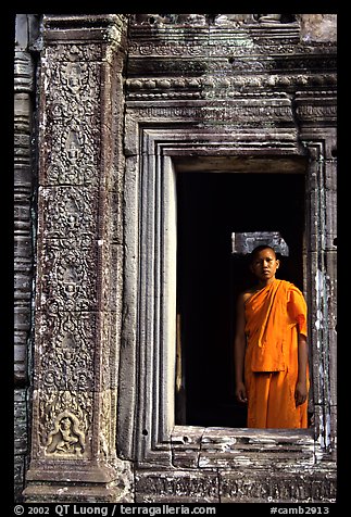 Buddhist monk in doorway, the Bayon. Angkor, Cambodia (color)