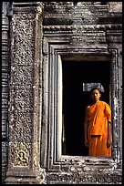 Buddhist monk in doorway, the Bayon. Angkor, Cambodia