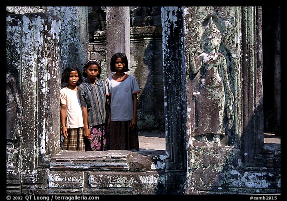 Girls in temple complex, the Bayon. Angkor, Cambodia (color)