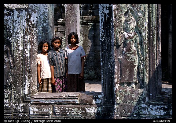 Girls in temple complex, the Bayon. Angkor, Cambodia