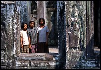 Girls in temple complex, the Bayon. Angkor, Cambodia (color)