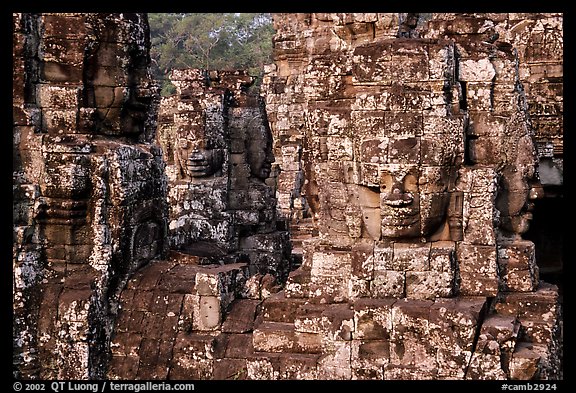 Large stone smiling faces on upper terrace, the Bayon. Angkor, Cambodia (color)