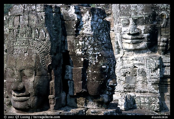 Large stone faces occupying towers, the Bayon. Angkor, Cambodia (color)