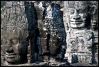 Large stone faces occupying towers, the Bayon. Angkor, Cambodia