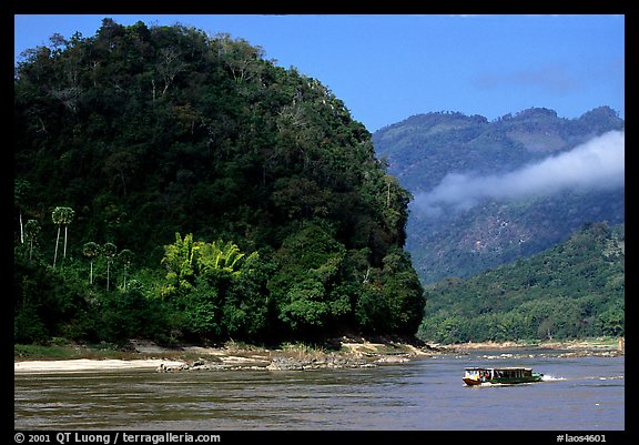 Slow passenger boat near Pak Ou. Mekong river, Laos (color)