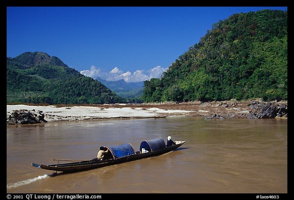 Narrow live-in boat. Mekong river, Laos (color)