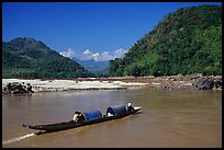 Narrow live-in boat. Mekong river, Laos