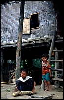 Children near stilt house of a small hamlet. Mekong river, Laos ( color)