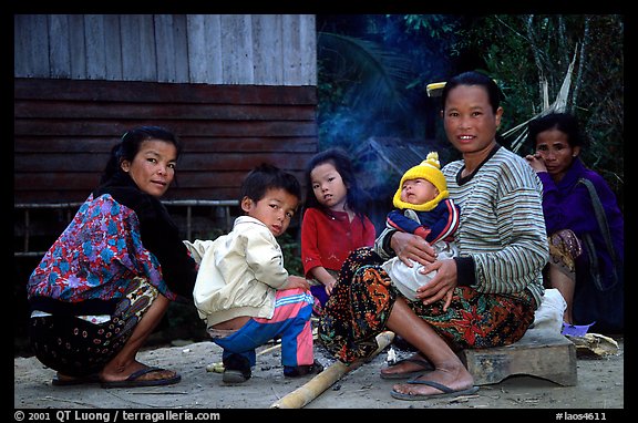 Group of women and children in a small hamlet. Mekong river, Laos