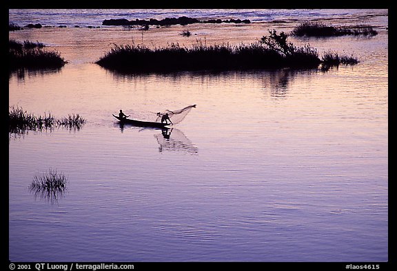 Fisherman casts net at sunset in Huay Xai. Laos (color)