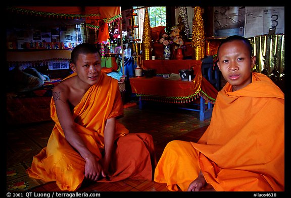 Buddhist novice monks inside temple. Luang Prabang, Laos (color)