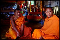 Buddhist novice monks inside temple. Luang Prabang, Laos