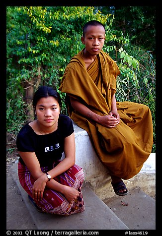 Buddhist novice monk and his sister. Luang Prabang, Laos (color)