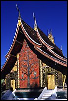 Rear of the Sim of Wat Xieng Thong with mosaic of the tree of life. Luang Prabang, Laos (color)