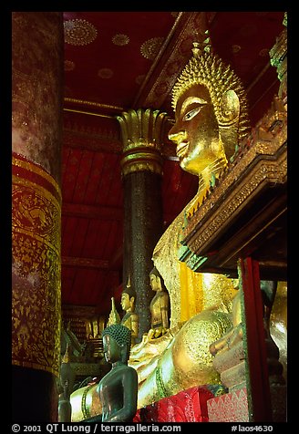 Buddha statues on altar, Wat Xieng Thong. Luang Prabang, Laos