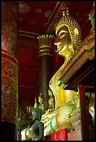 Buddha statues on altar, Wat Xieng Thong. Luang Prabang, Laos (color)