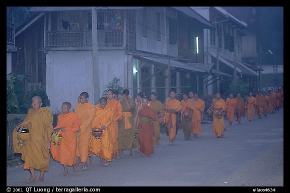 Morning alms procession of buddhist monks. Luang Prabang, Laos