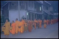 Morning alms procession of buddhist monks. Luang Prabang, Laos ( color)