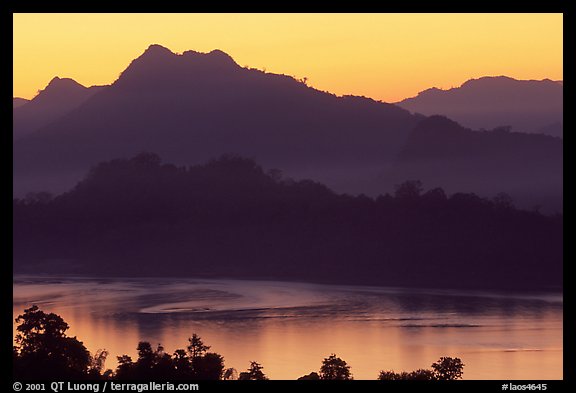 Hills, sunset on the Mekong river. Luang Prabang, Laos