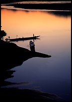 Boats, sunset on the Mekong river, Luang Prabang. Mekong river, Laos (color)