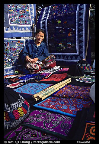 Young woman sells crafts on market. Luang Prabang, Laos