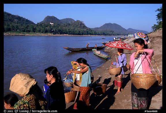Women on the banks of the Mekong river. Luang Prabang, Laos (color)