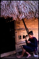 Woman of the Lao Huay tribe in front of her hut,  Ban Nam Sang village. Laos ( color)