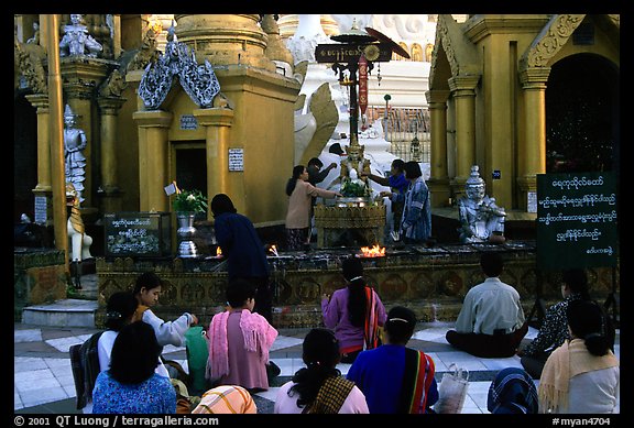 Water offering at Planetery post, Shwedagon Paya. Yangon, Myanmar (color)