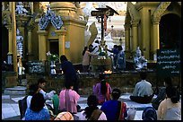 Water offering at Planetery post, Shwedagon Paya. Yangon, Myanmar (color)