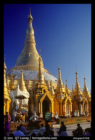 Praying at Planetery post, the Shwedagon Paya. Yangon, Myanmar