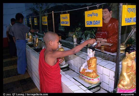 Novice offering Water at  Mahamuni Paya. Mandalay, Myanmar