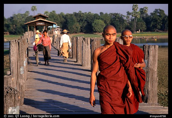 On the two century old U Bein bridge, Amarapura. Mandalay, Myanmar