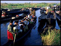 Children commuting to school on small boat. Inle Lake, Myanmar