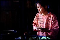 Woman Making cheerots. Inle Lake, Myanmar (color)