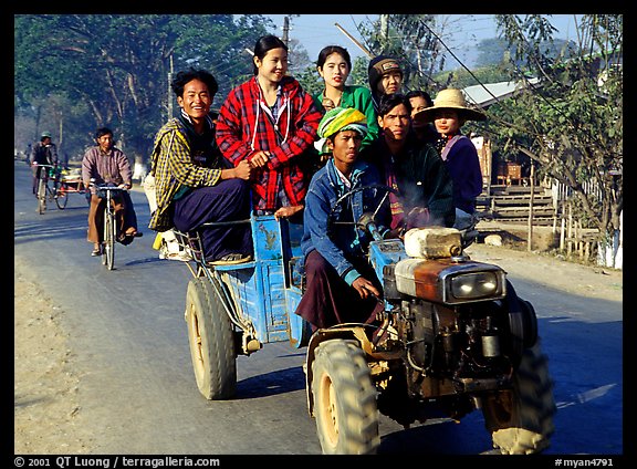 Riding tractor on road near Swwenyaung. Shan state, Myanmar