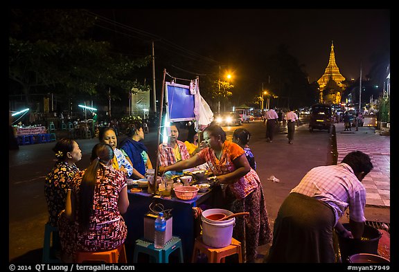 Streat food served at night, Shwedagon Pagoda in background. Yangon, Myanmar (color)