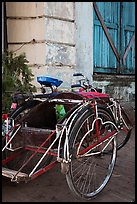 Sai kaa rickshaw and old facade. Yangon, Myanmar ( color)