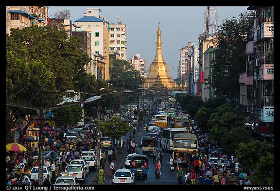 Street with busy traffic leading to Sule Pagoda. Yangon, Myanmar (color)