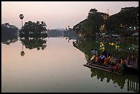 Families on shore of Kandawkyi Lake at sunset. Yangon, Myanmar ( color)