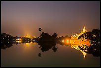 Shwedagon Pagoda and Karawek Hall reflected in Kandawgyi Lake. Yangon, Myanmar