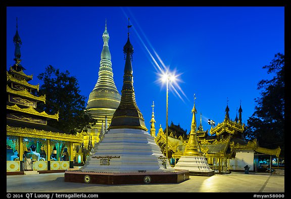 Shrines, stupas, and Main Stupa at dawn, Shwedagon Pagoda. Yangon, Myanmar (color)