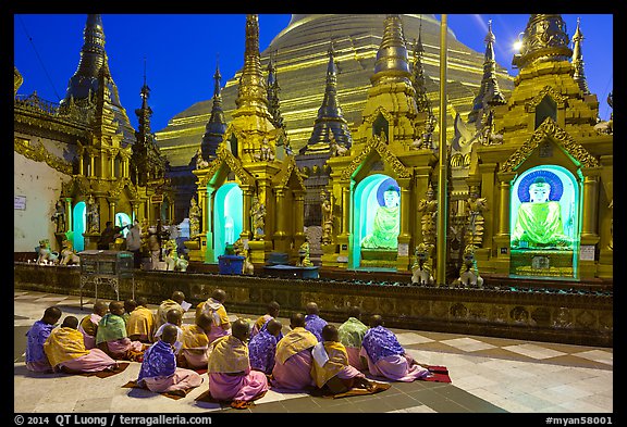 Nuns praying, Shwedagon Pagoda. Yangon, Myanmar