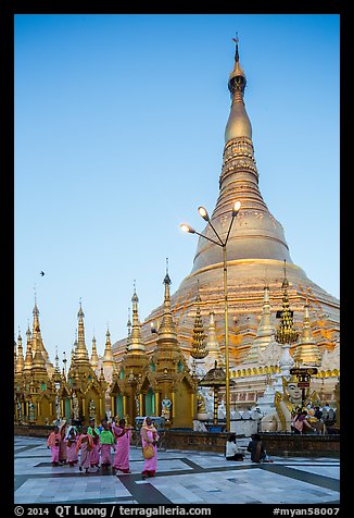Nuns walking at the base of main chedi, Shwedagon Pagoda. Yangon, Myanmar (color)