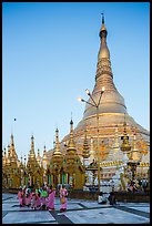 Nuns walking at the base of main chedi, Shwedagon Pagoda. Yangon, Myanmar ( color)