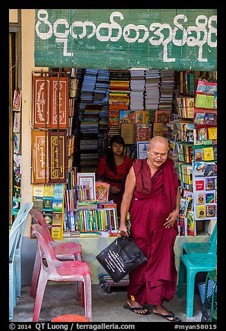 Monk leaves bookstore, Shwedagon Pagoda. Yangon, Myanmar