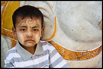 Child with thanaka paste next to elephant. Yangon, Myanmar ( color)