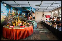 Visitors play arcade game, Botataung Pagoda. Yangon, Myanmar ( color)