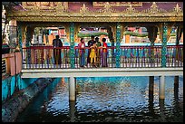 Family at turtle pond, Botataung Pagoda. Yangon, Myanmar ( color)