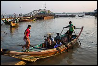 Woman boards boat to cross the Yangon River. Yangon, Myanmar ( color)