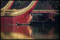 Man rowing boat next to Karawek barge. Yangon, Myanmar ( color)